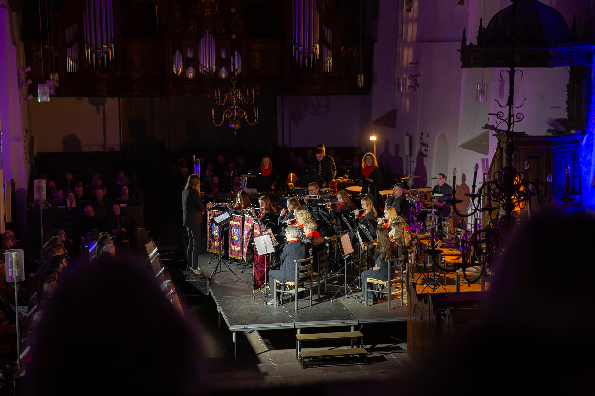 Chris standing up holding his daughter Elva